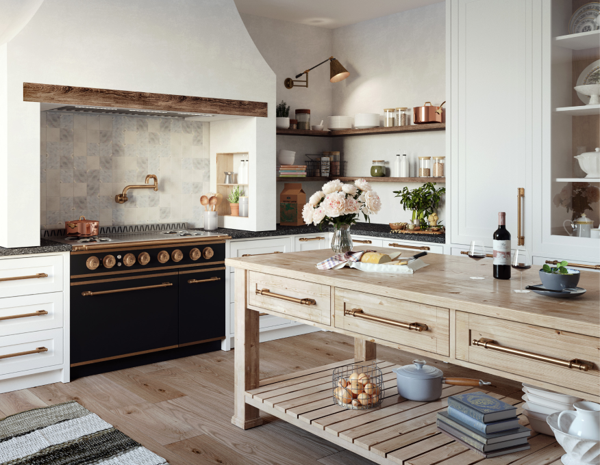 Bright, rustic-chic kitchen featuring a black and copper La Cornue range set in a stucco alcove with a rough wooden beam, a light wood island with copper drawer pulls and open slatted shelving, and white lower cabinets with black countertops and open wood shelving.