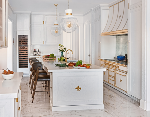 White classic kitchen ranges with white luxury cabinets with golden borders