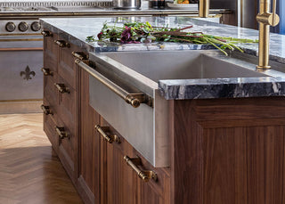 Textured marble countertop above Wooden kitchen cabinets 