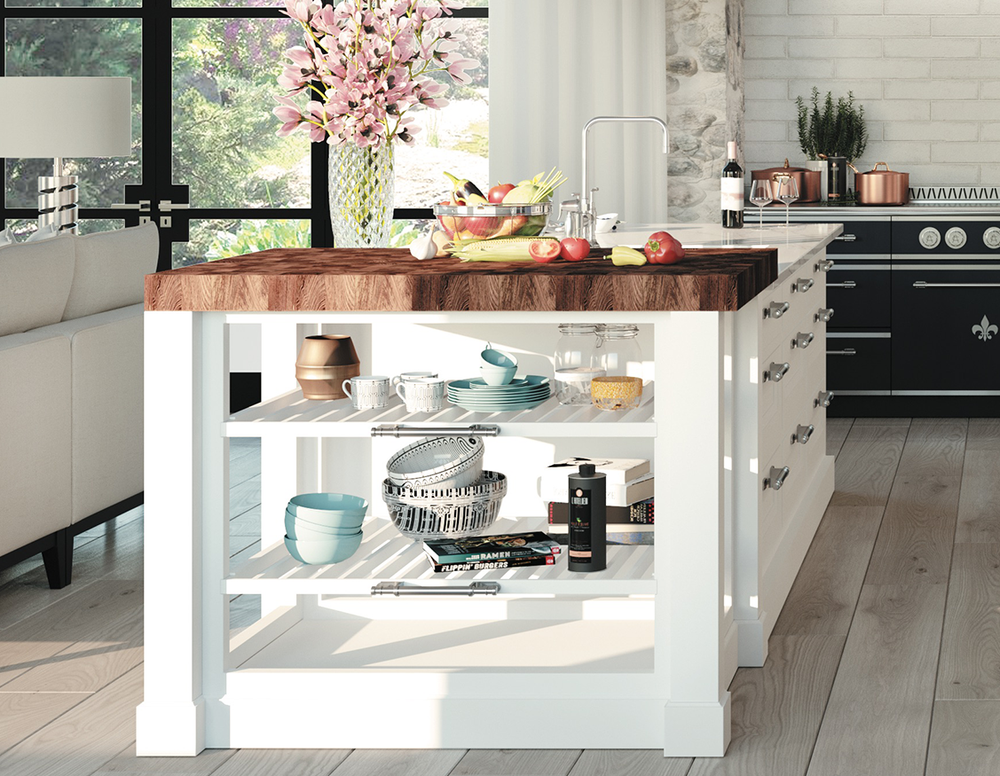 A large white kitchen island with a dark wood top, open shelves displaying dishes and cookbooks, in a bright modern home