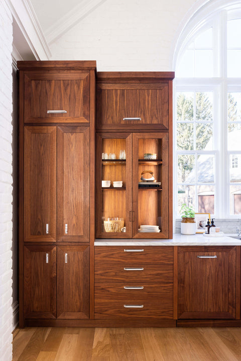 Wooden kitchen storage cabinets and drawers with silver handles