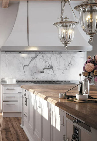 High end French kitchen design with white kitchen range, white hood and white drawers