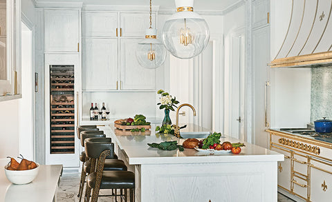 White Kitchen Countertop and Kitchen Cabinets With Off White and Golden Classic Kitchen Ranges