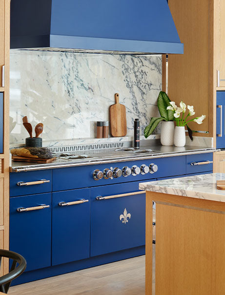 Blue Custom Kitchen Hoods above Blue French Kitchen Cabinets