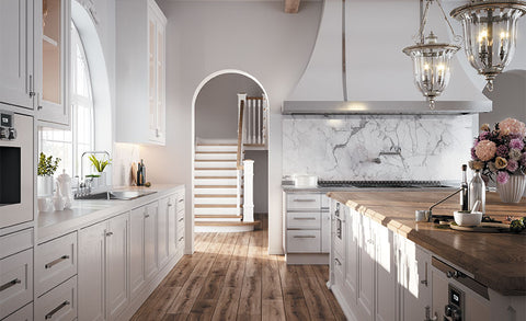 White kitchen ranges with white cabinets, in-built closets, white hood