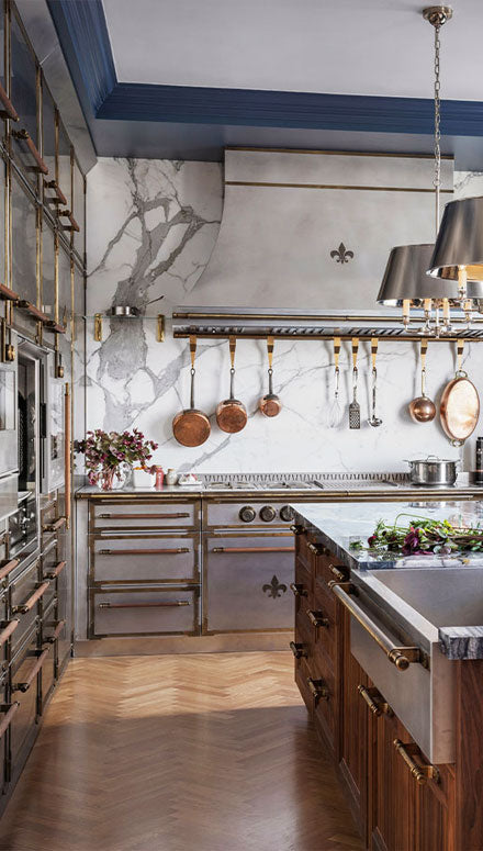 Wooden Kitchen Cabinets below marble countertop and gray French Kitchen Ranges