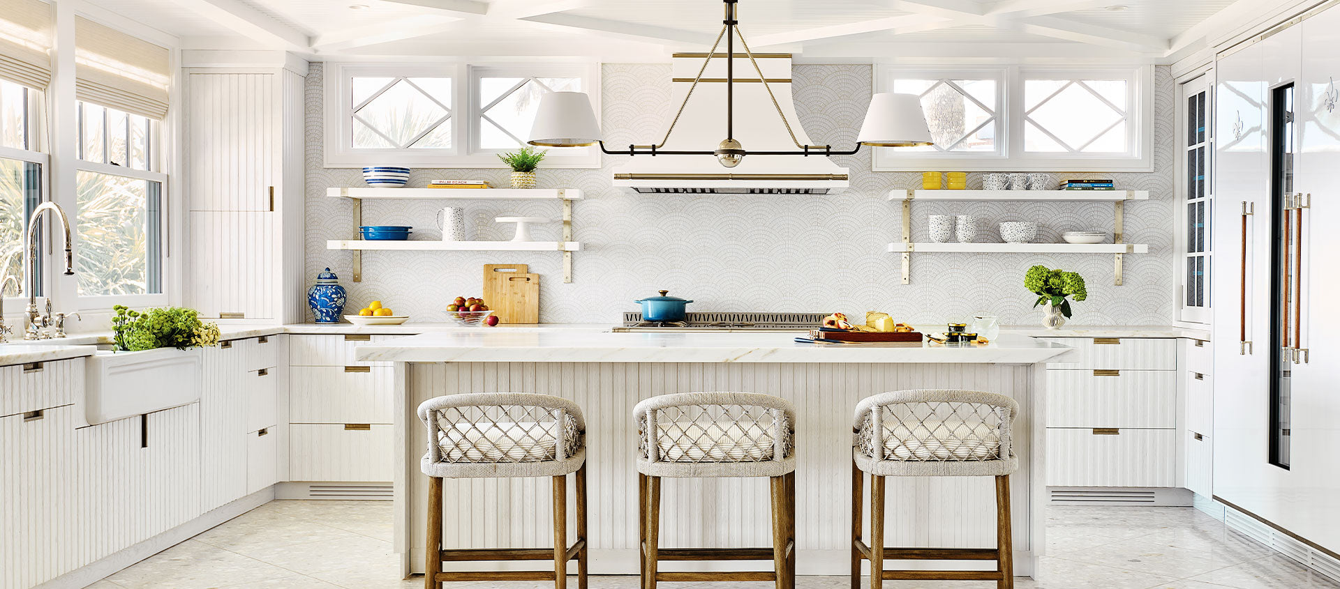 High end kitchen design of white kitchen with white French kitchen ranges, white cupboards, white kitchen cabinets