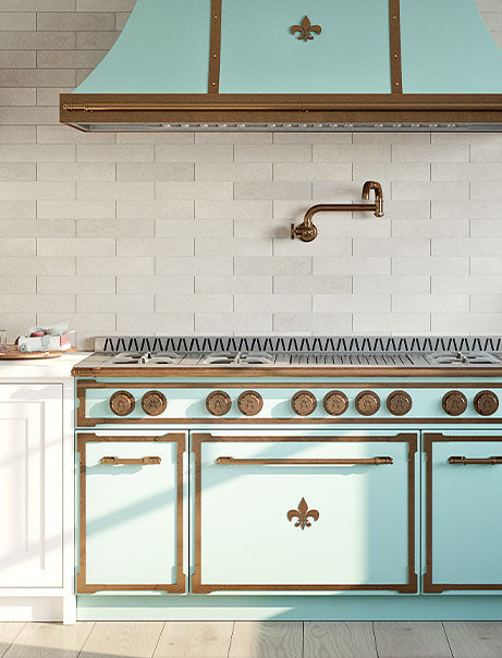 Pale Turquoise & Copper Color Kitchen Exhaust Hood above Pale Turquoise & Copper Color Kitchen Oven and Cabinets