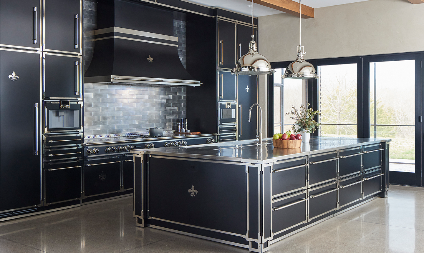 Black Kitchen Base Cabinet With Silver Handles and Countertop In the middle of the Kitchen. Black Classic Kitchen Ranges With a Hood and Black Kitchen Wall Cabinets