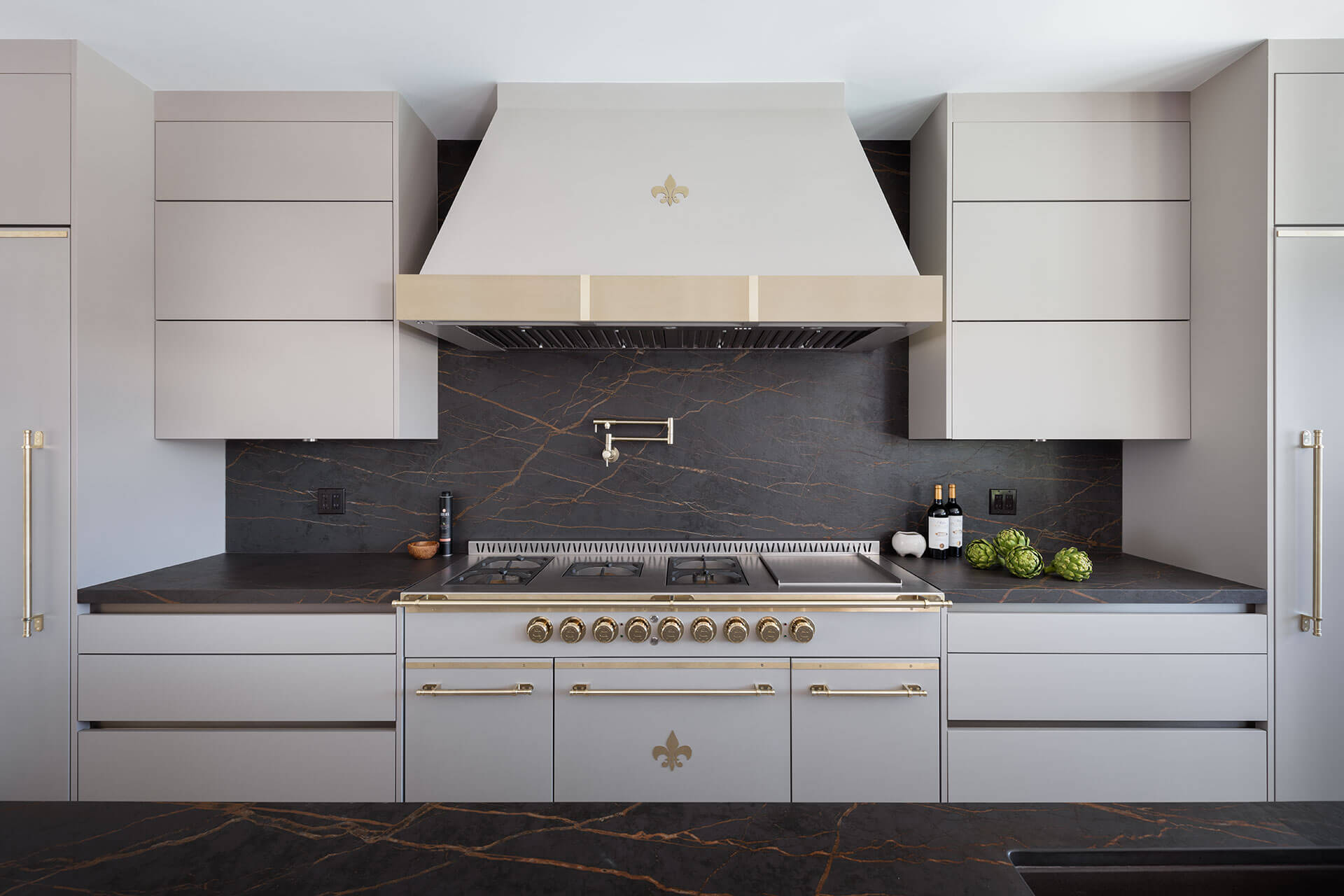 White French Kitchen Ranges With Golden Burners and Cabinet Handles