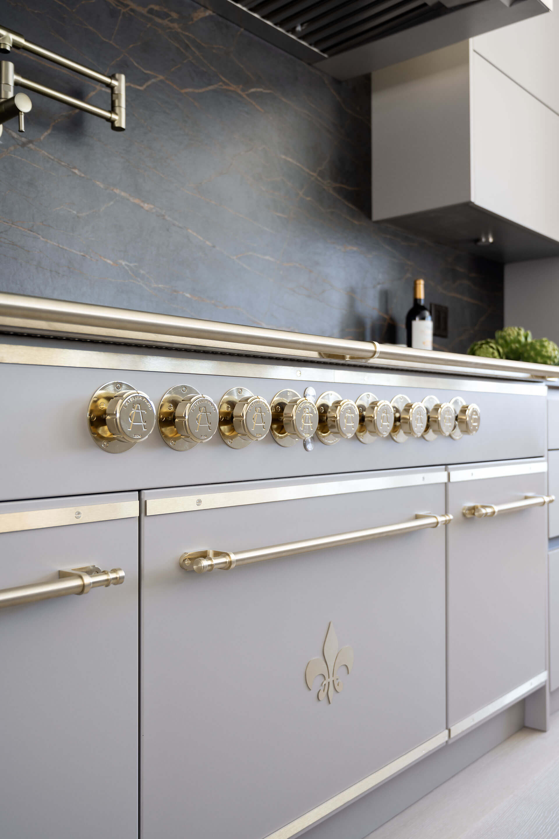 L’Atelier Paris French Kitchen Ranges in white color with golden burners and handles