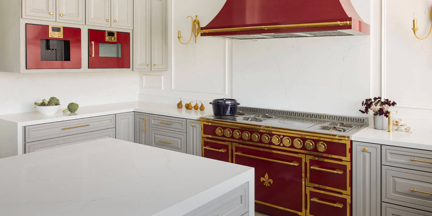 Luxury Kitchen Ranges with Red custom cabinets and golden handles and burners