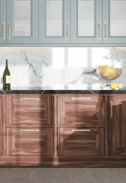 Wooden kitchen drawers under marble countertops and squirrel grey color hanging cupboards